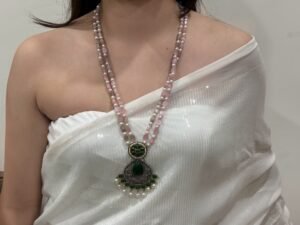 Elegant Pink Beaded Necklace with Green Enamel Pendant and Jhumka Earrings